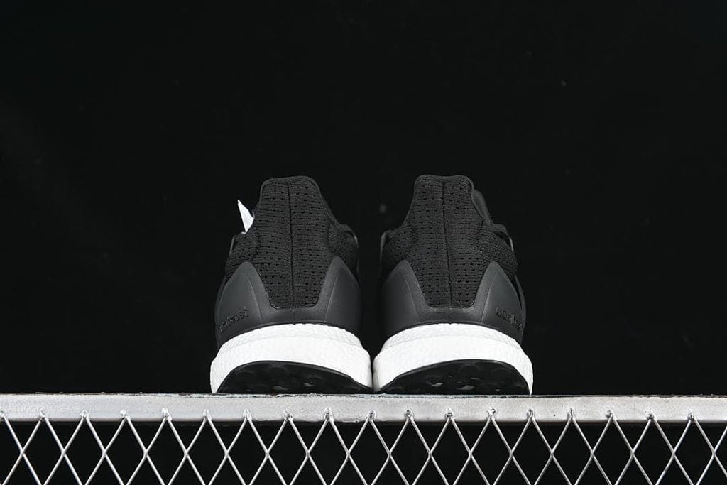 Rear view of the pair showing heel details and white midsoles.