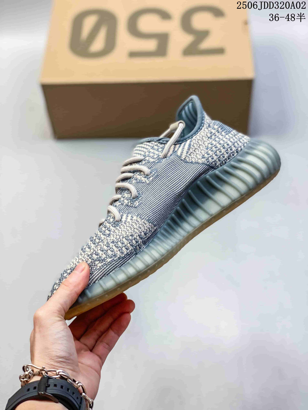 Side profile of a gray multicolor knit sneaker with a ribbed sole