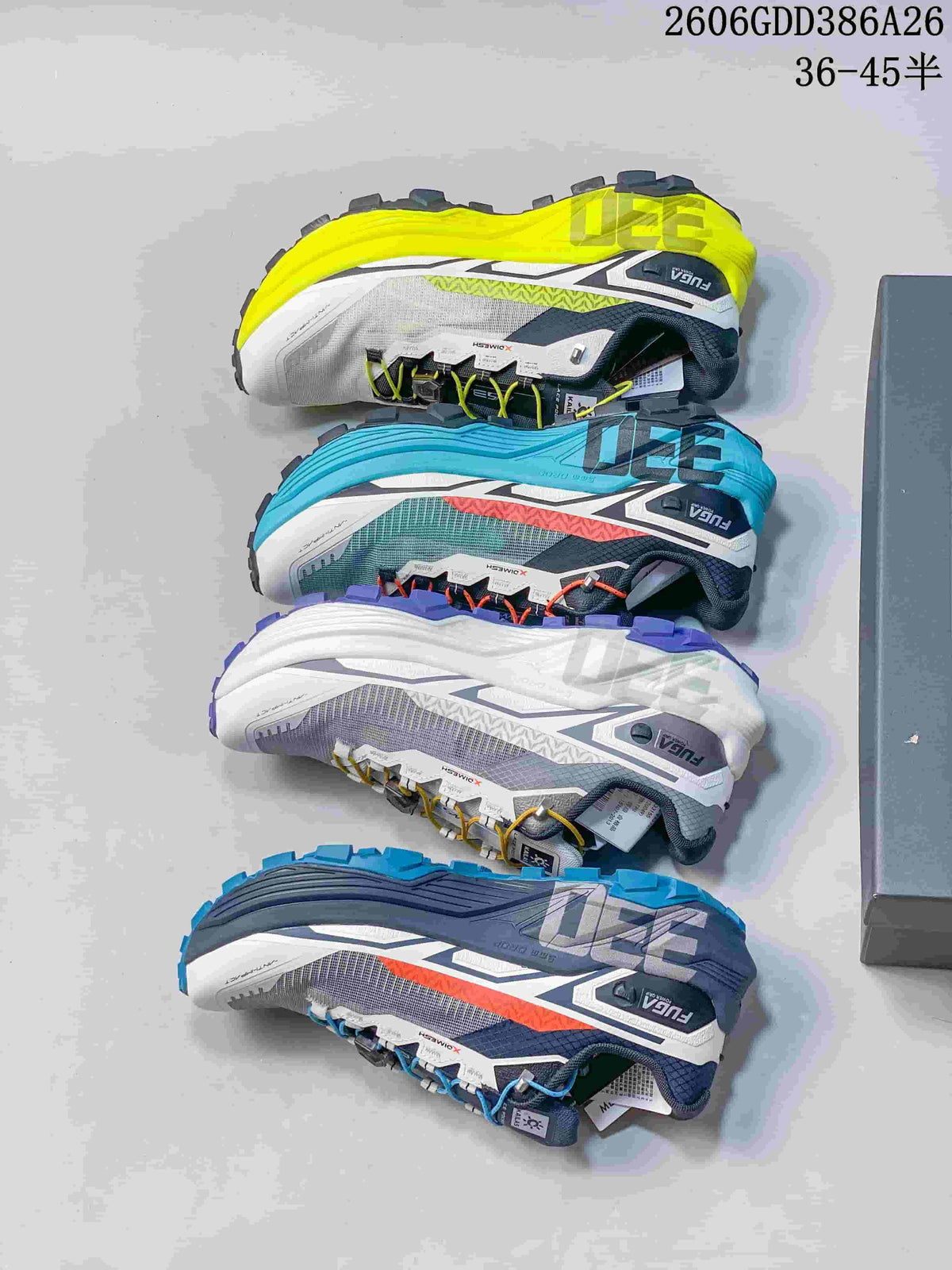 Four KAILAS FUGA EX330 trail shoes shown in yellow, turquoise, white, and blue color combinations