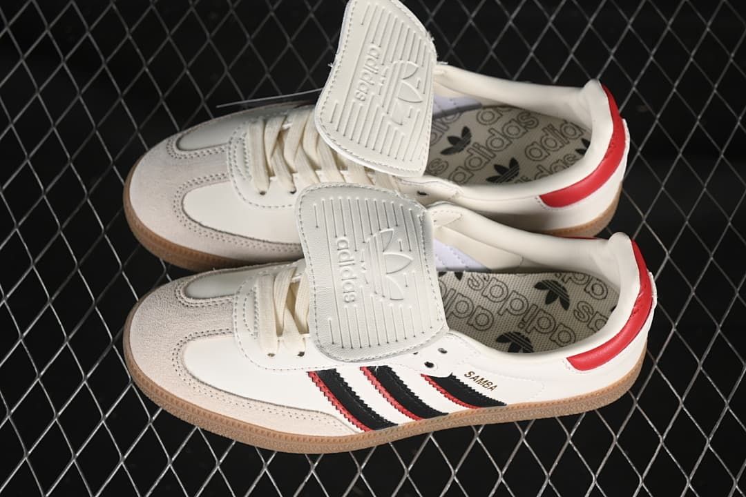 Pair of Samba LT sneakers showing the fold-over tongues and patterned insoles.