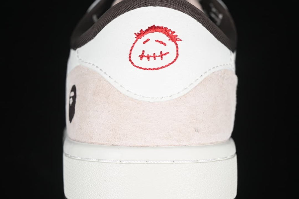 Rear heel close-up with embroidered graphic and pale overlay