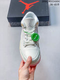 Front view of a white Air Jordan 3 Retro sneaker with pale mint details and pink outsole accents