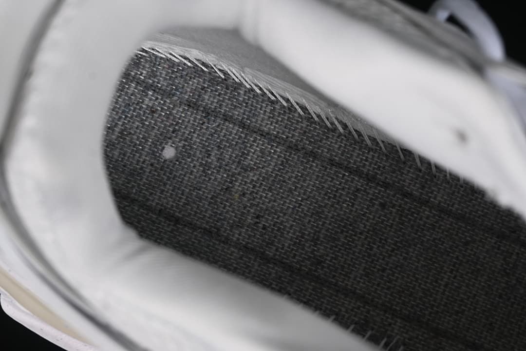 Close-up view inside the sneaker showing mesh and layered construction