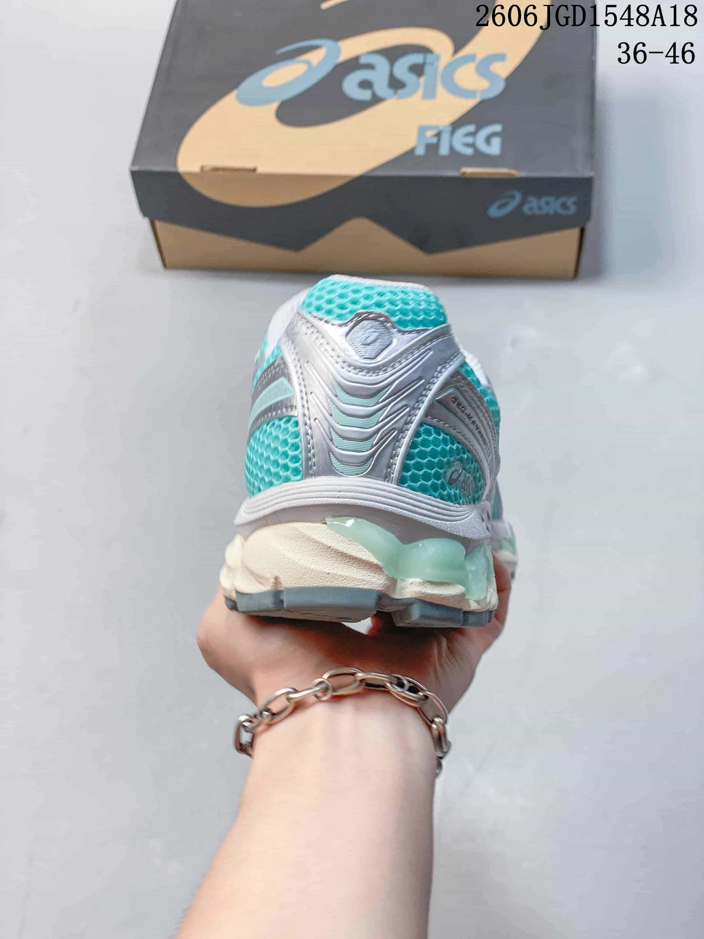 Rear view showing the heel details and layered sole of the running shoe.