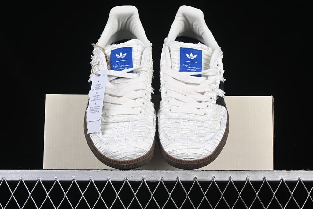 Front view of the pair showing the white laces and brown outsoles