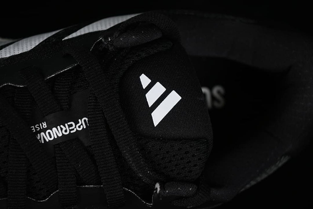 Close-up of the tongue, laces and adidas logo.