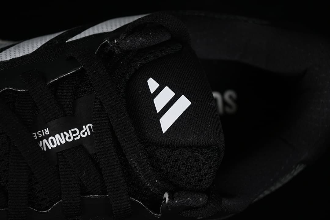 Close-up of the tongue, laces and adidas logo.