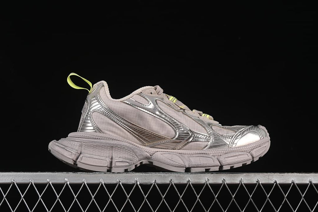 Side profile of one sneaker showing the chunky sole and layered panels