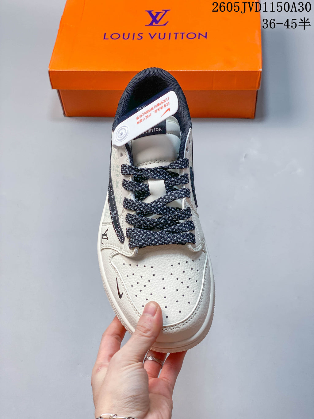 Top view of the sneaker showing its perforated toe, braided laces, and dark collar lining.