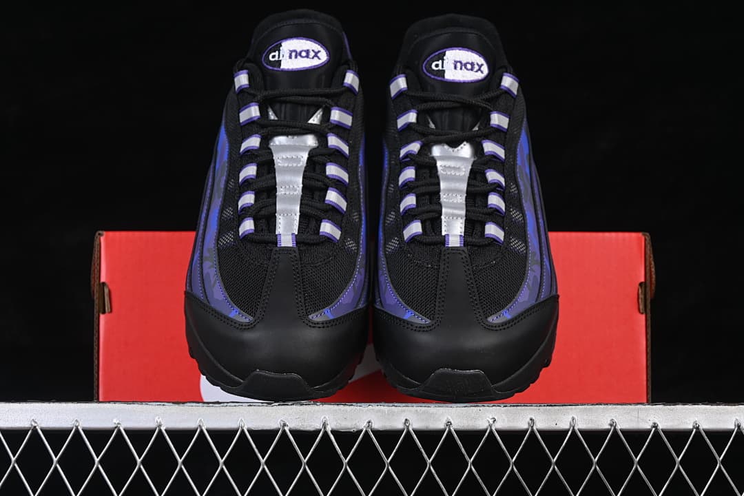 Front view of the pair showing black toe sections and purple-blue side accents