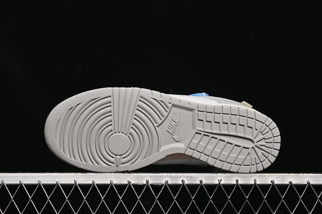 Underside view showing the grey patterned rubber outsole