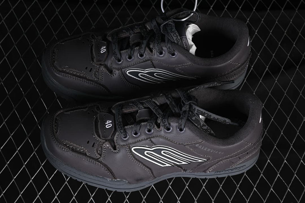 Pair of grey low-top sneakers viewed from above