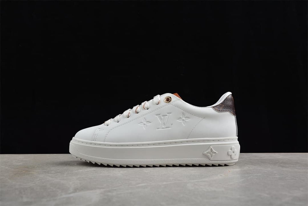 White Time Out Low platform sneaker with brown heel accent and sawtooth-style sole