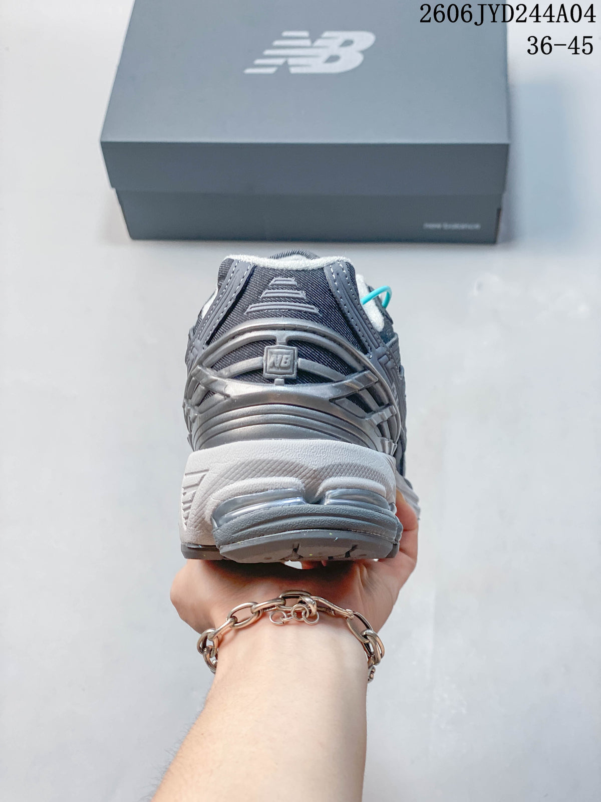 Rear view of a gray New Balance 1906R sneaker