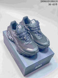 Pair of gray KAILAS FUGA trail running shoes shown from the front on a shoe box
