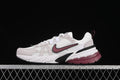 Side view of Nike V2K Run sneakers in white, light neutral, burgundy, and black