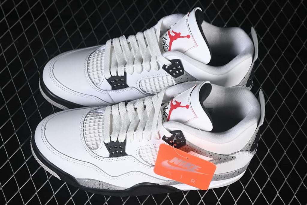 Pair of White Cement sneakers shown from above at an angle