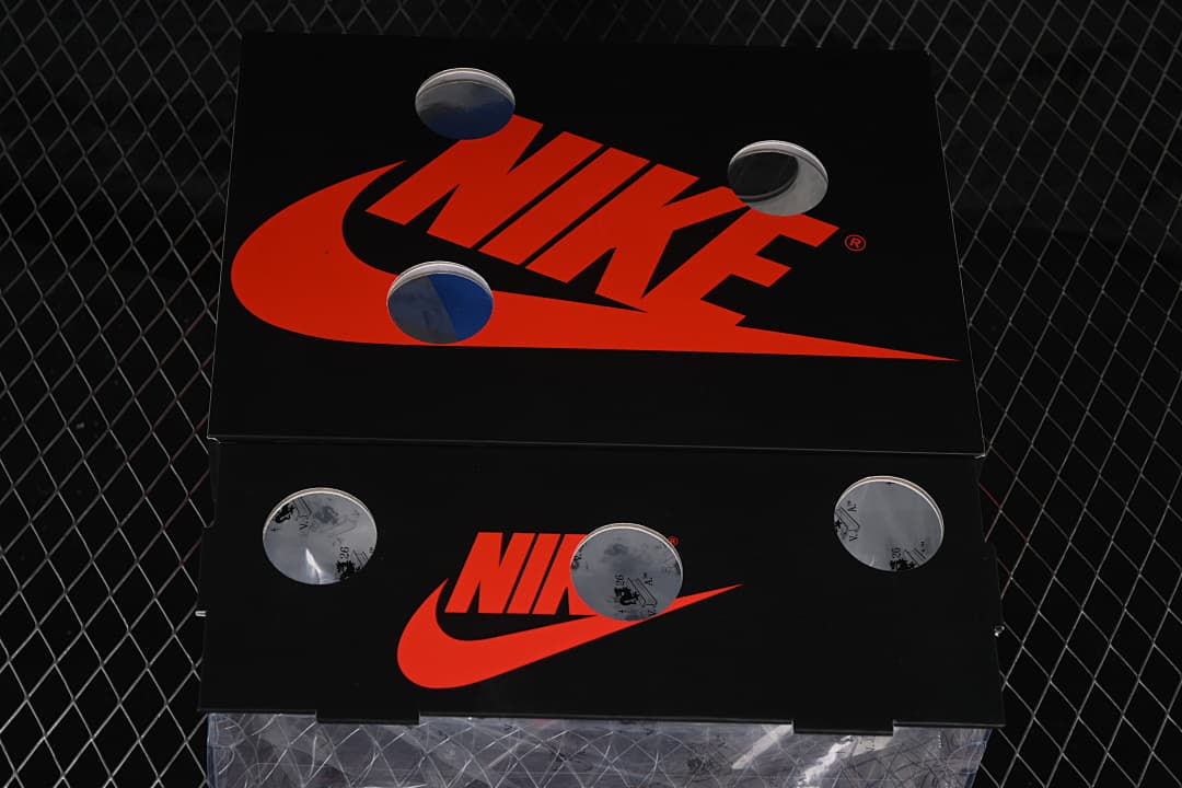 Black shoe boxes with prominent red Nike branding