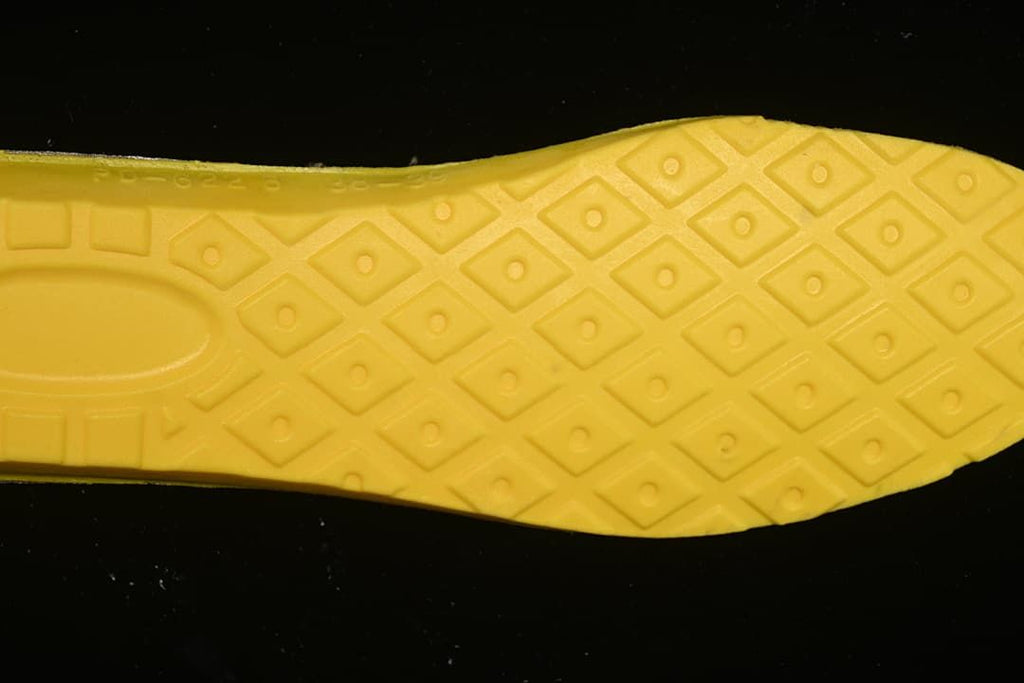 Close-up of the boot's yellow patterned footbed underside
