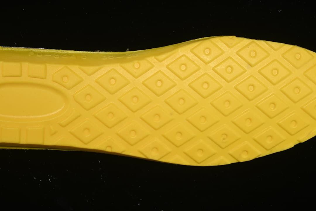 Close-up of the boot's yellow patterned footbed underside