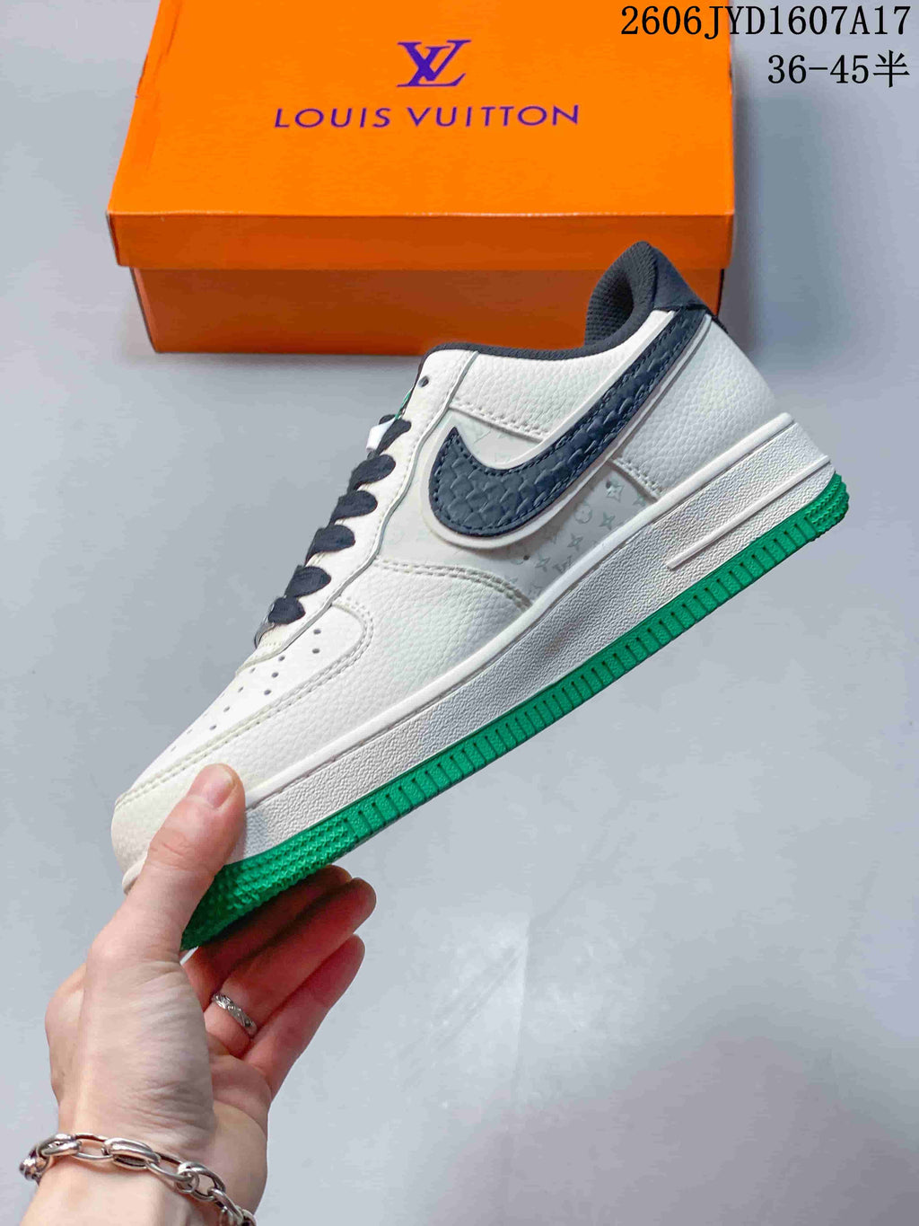 Side view of an off-white low-top sneaker with dark swoosh and green outsole