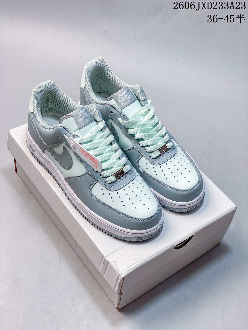 Pair of pale blue and white Nike Air Force 1 '07 Low sneakers shown from above