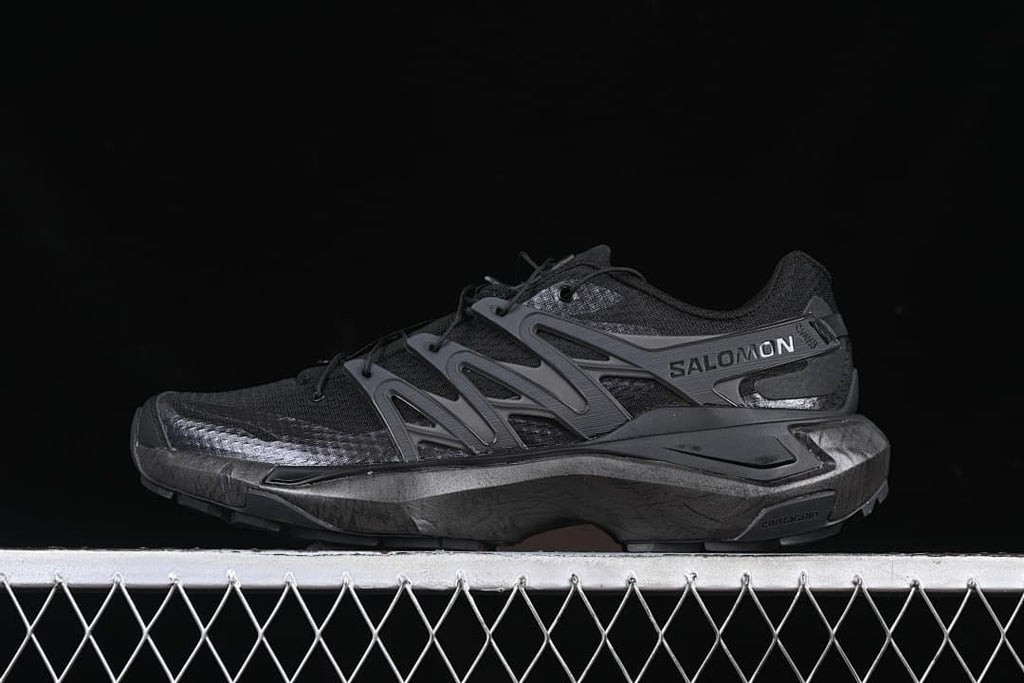 Side view of a black and dark grey Salomon XT Pure Advanced trail shoe.