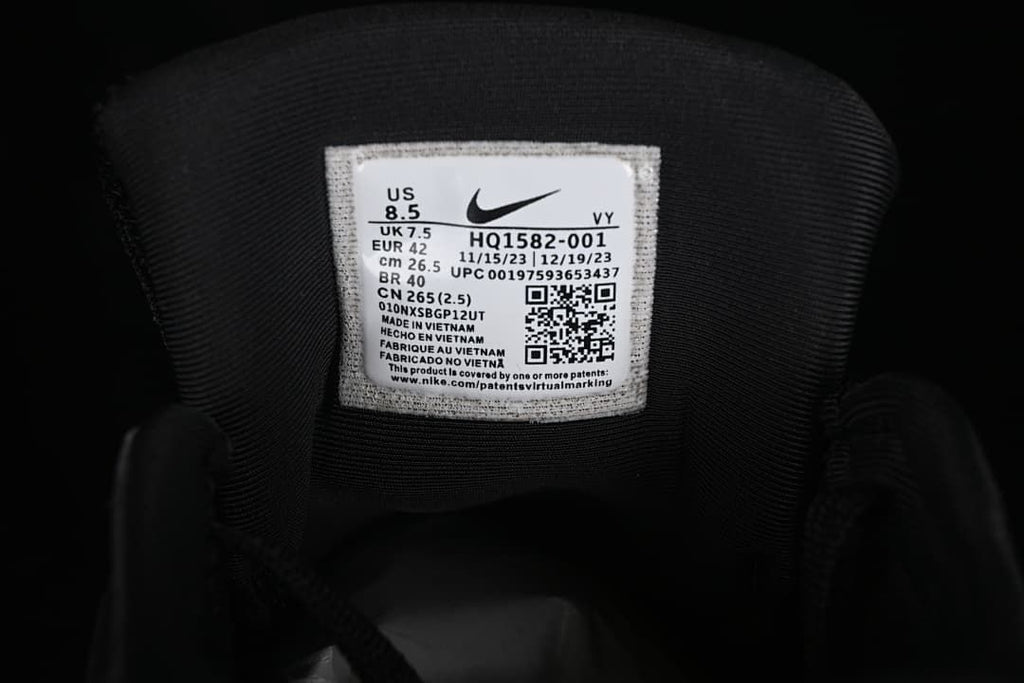 Tongue label showing Nike V2K Run style code HQ1582-001 and photographed size EU 42.