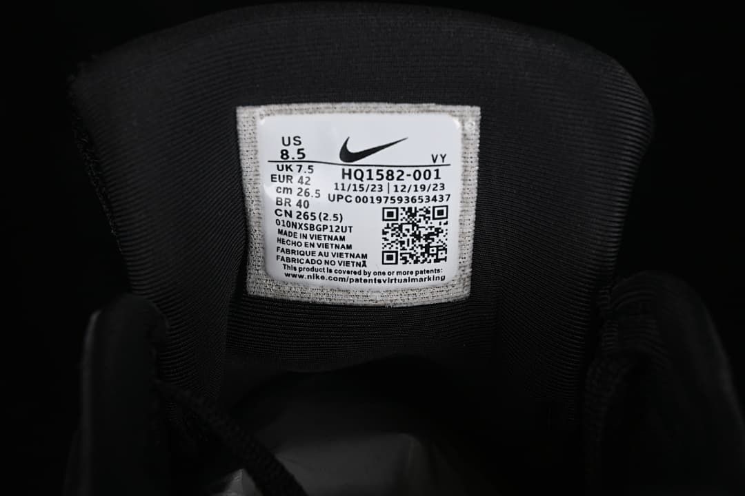 Tongue label showing Nike V2K Run style code HQ1582-001 and photographed size EU 42.