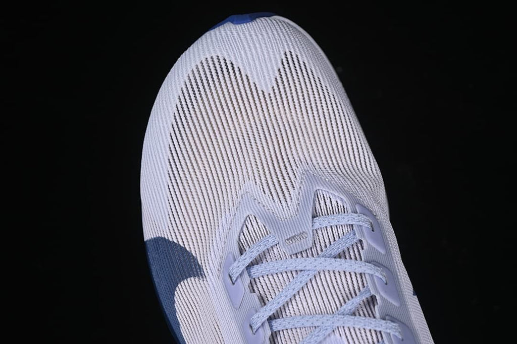 Top view of the shoe’s striped upper and lacing