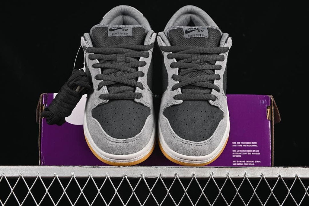 Front view of the pair with perforated toe panels and gum-colored outsoles