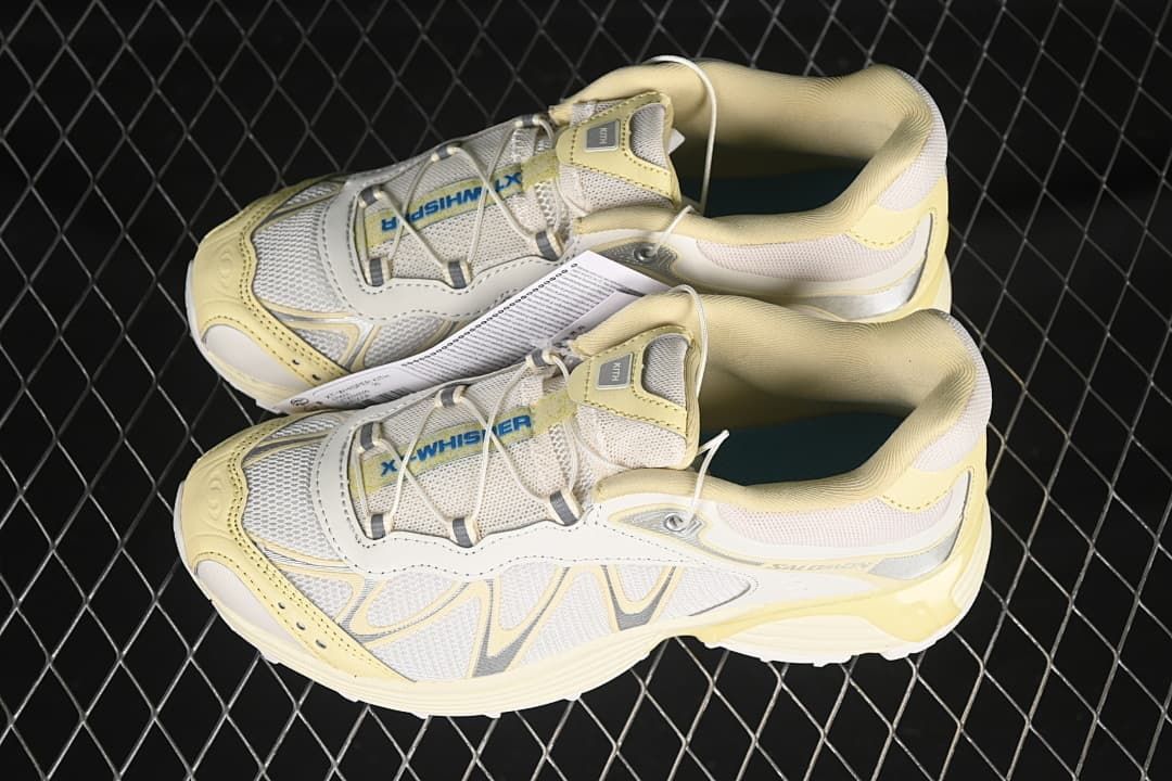 Pair of pale yellow and cream Salomon XT-Whisper shoes