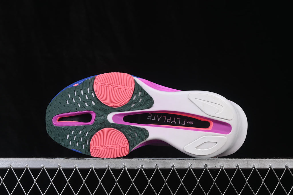 Bottom view showing the running shoe outsole, patterned grip, and colored sections.