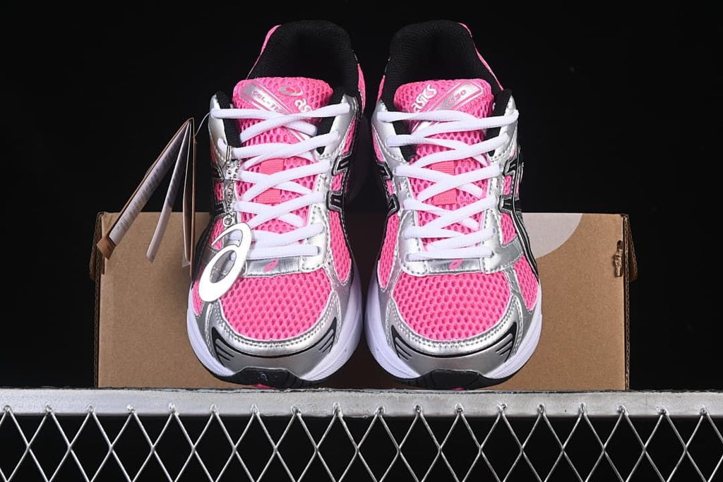 Front view of the pair showing pink uppers, silver panels, and white laces.