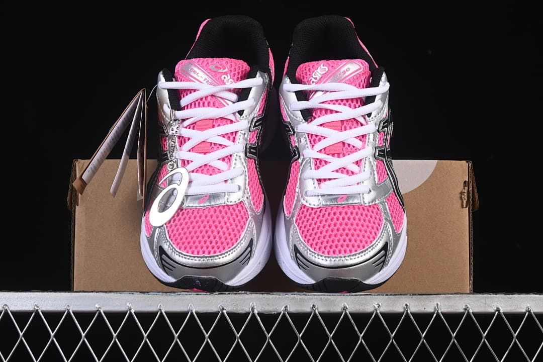 Front view of the pair showing pink uppers, silver panels, and white laces.
