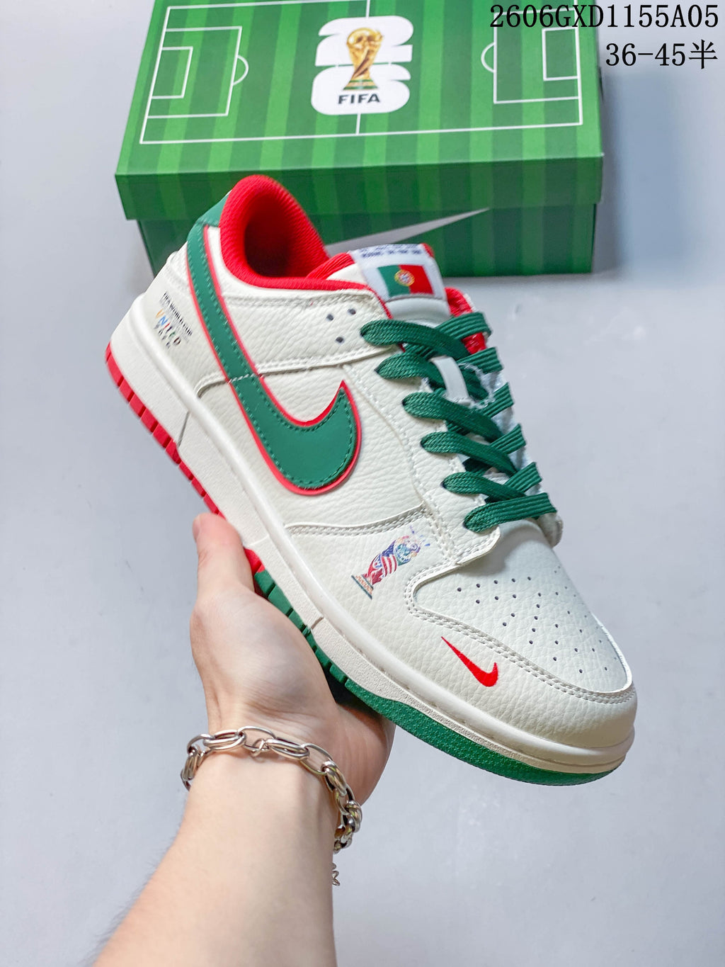 Angled side view showing the green side panel, red accents, and Portugal flag detail on the tongue
