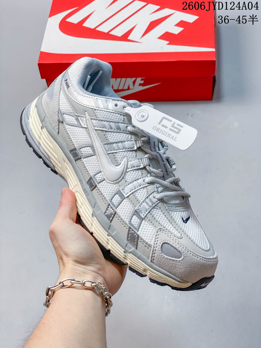 Angled side view of the Nike P-6000 sneaker with layered gray panels
