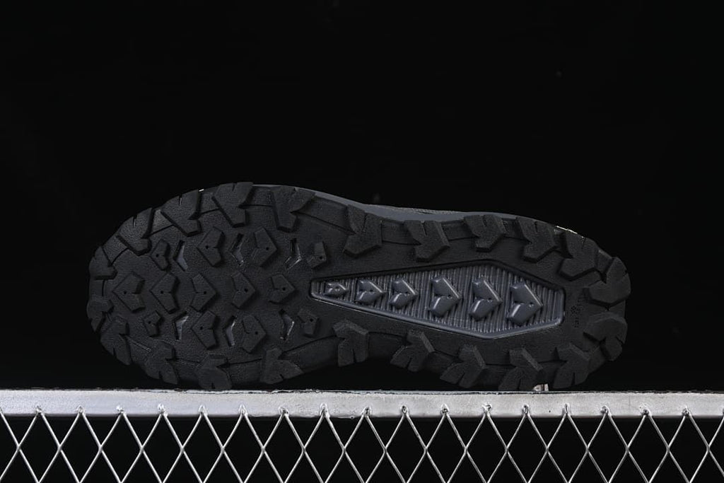 Underside view showing the outsole's prominent tread lugs