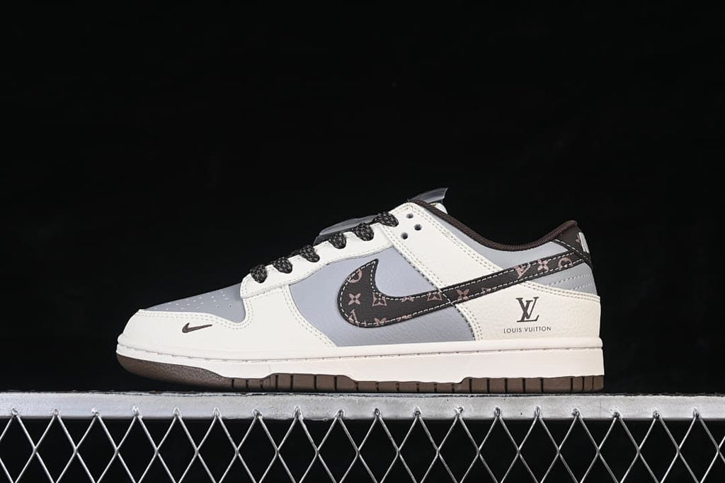 Side view of a white and gray low-top sneaker with a patterned brown swoosh and dark outsole.