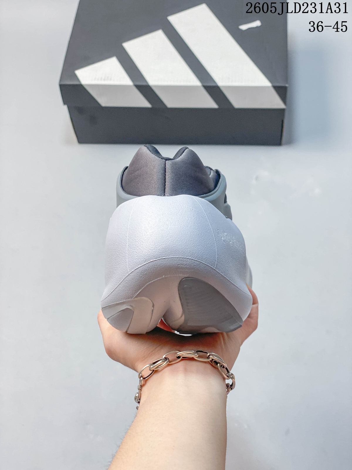 Rear view of a grey Adidas Hyperboost sneaker with a sculpted white heel and sole.