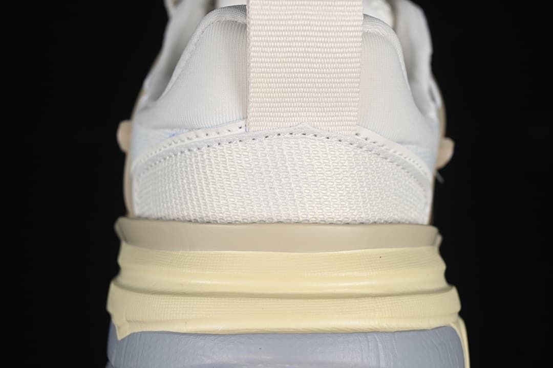 Rear close-up of the sneaker heel, mesh panel, and layered sole
