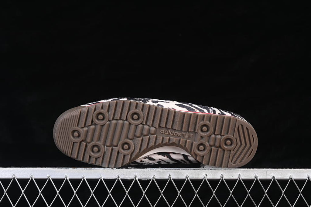 Underside view showing the brown outsole and its ridged tread pattern.