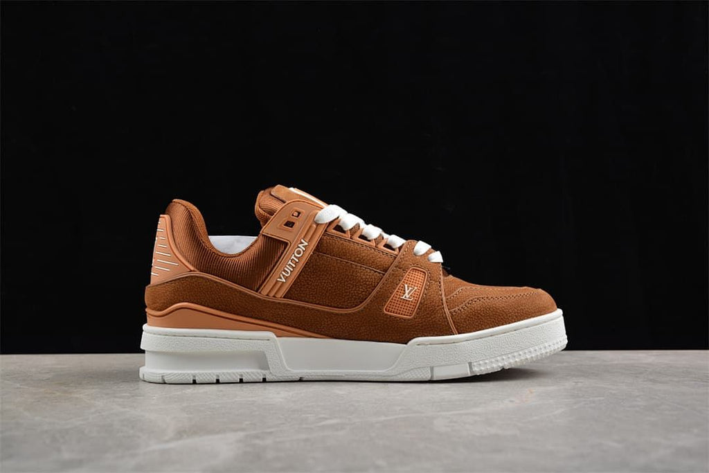 Side profile of a brown LV Trainer sneaker with white sole