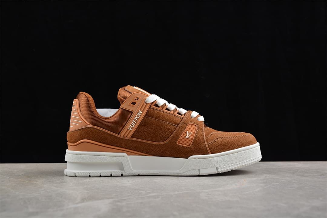 Side profile of a brown LV Trainer sneaker with white sole