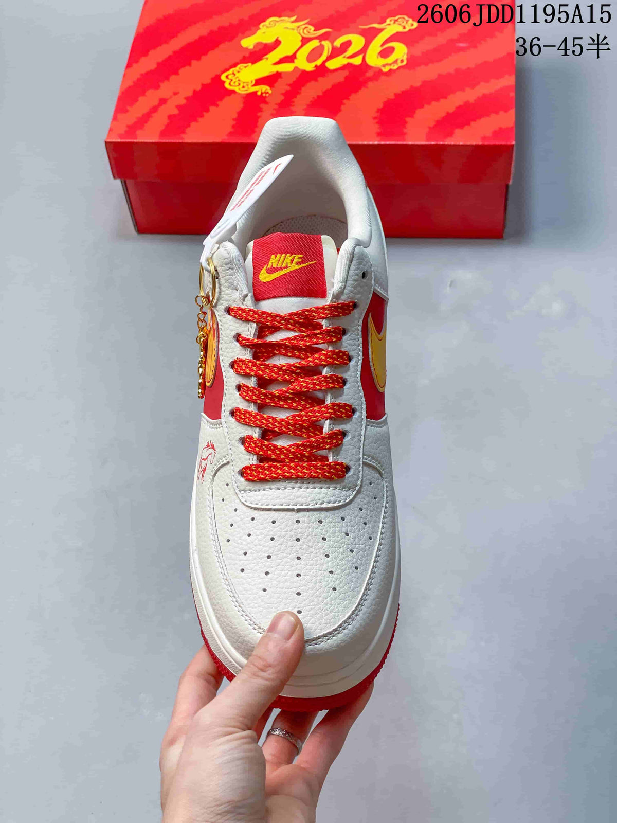 Front view highlighting the perforated toe, red laces, and yellow tongue logo