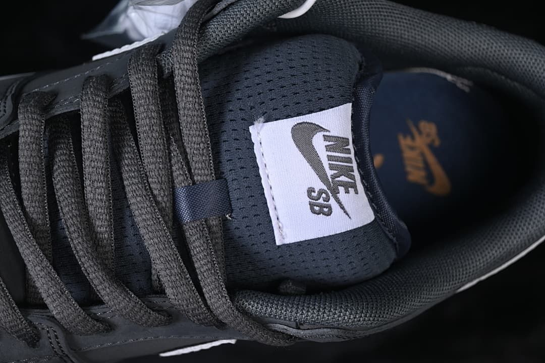 Close-up of the Nike SB tongue label and gray laces.