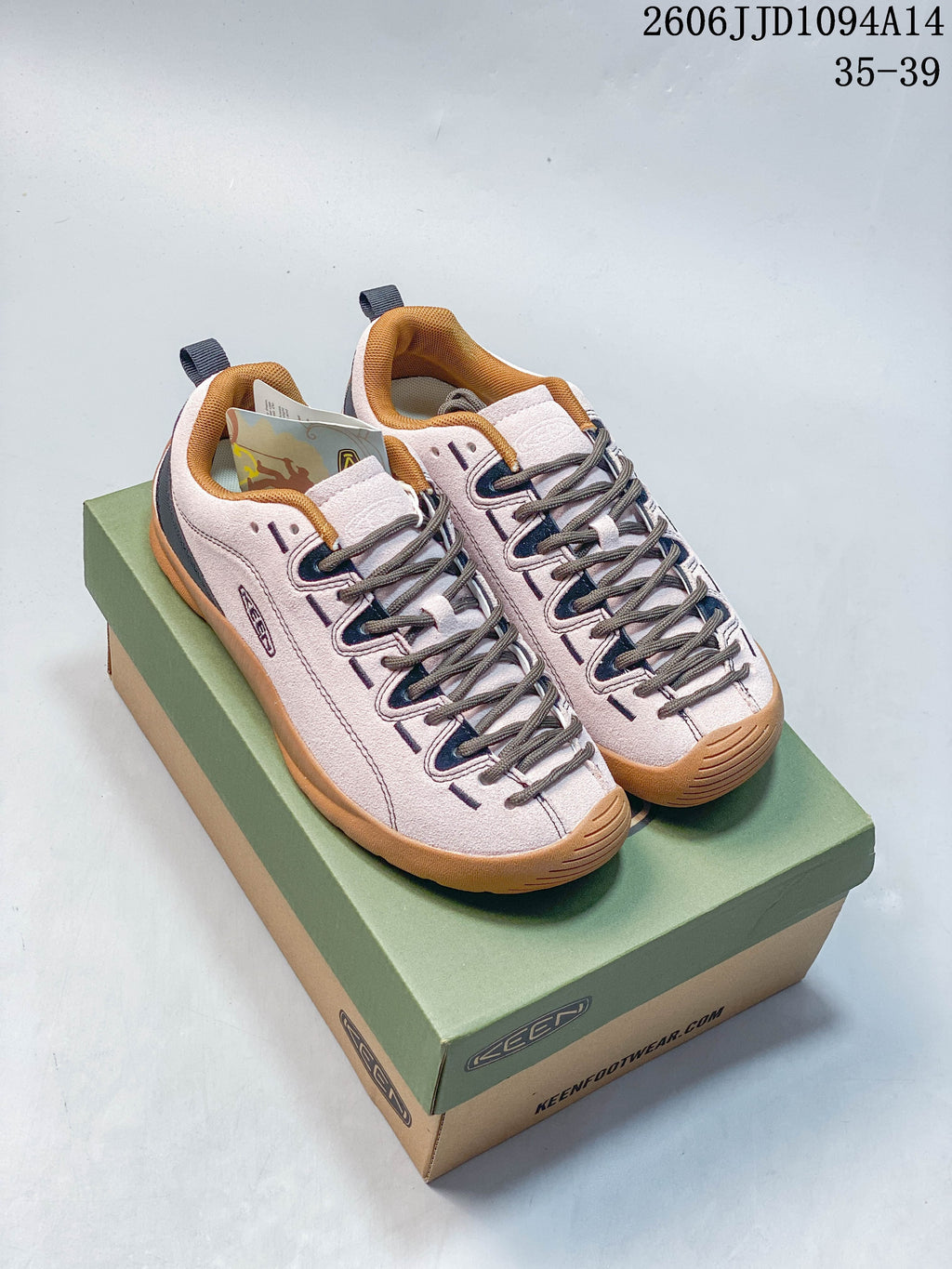 Pair of pale pink KEEN Jasper low-top sneakers with navy accents and gum-toned soles