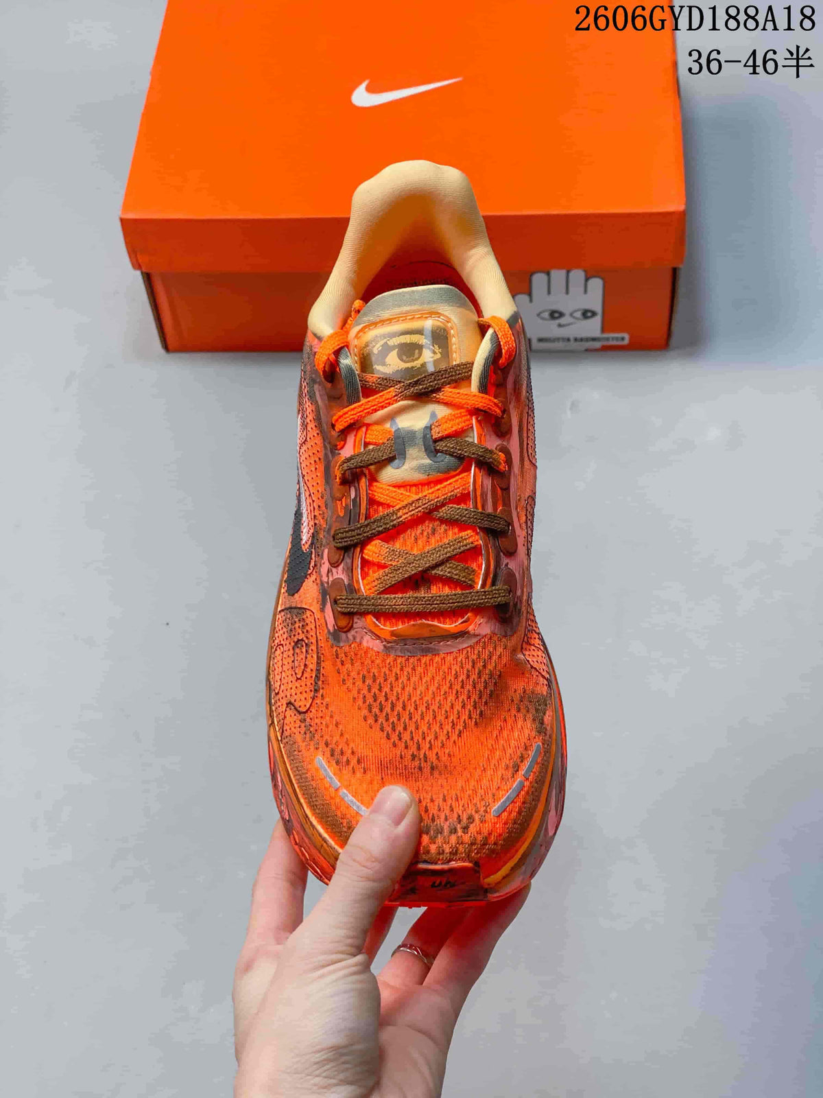 Front view of an orange Nike Air Pegasus Premium sneaker with contrasting laces.
