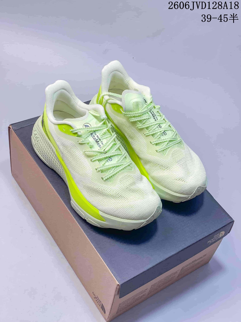 Pair of white Alta Mesa 500 running shoes with bright lime accents and matching laces.