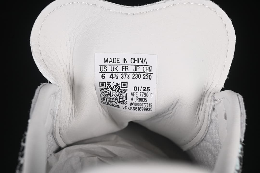 Close-up of the tongue label showing US 6, UK 4½, EU 37⅓, JP 230, and CHN 230